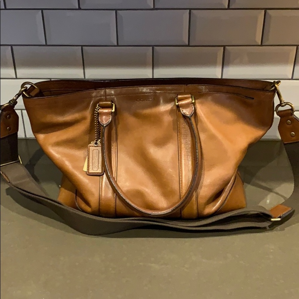 Good condition saddle brown coach bag .